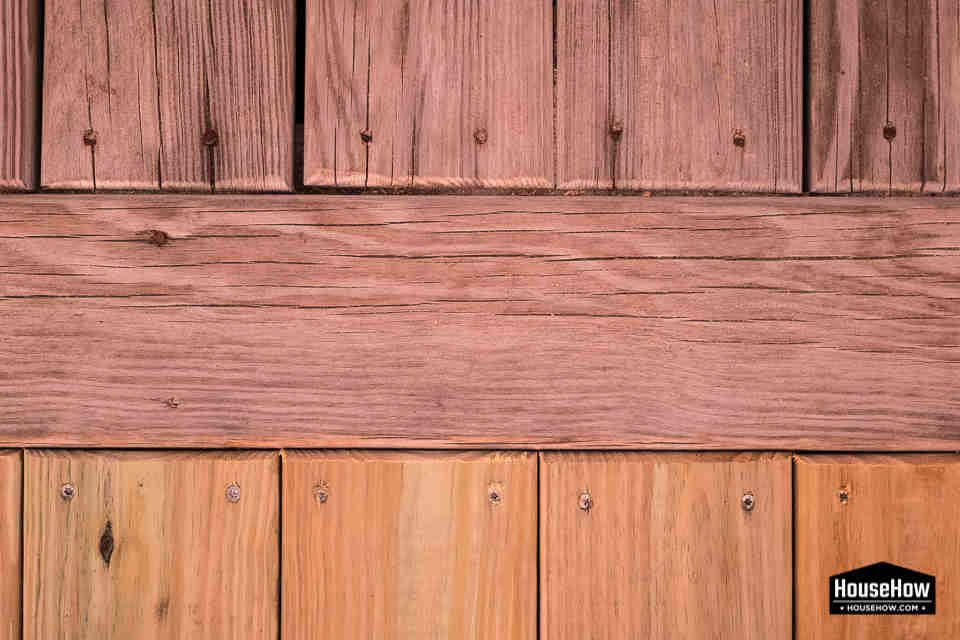 Over time pressure treated wood changes color from green to grey © HouseHow.com