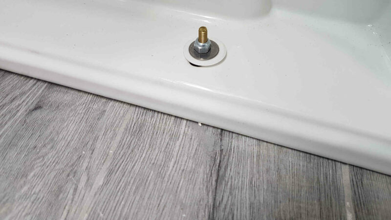 Should You Tile Around or Under a Toilet © HouseHow.com